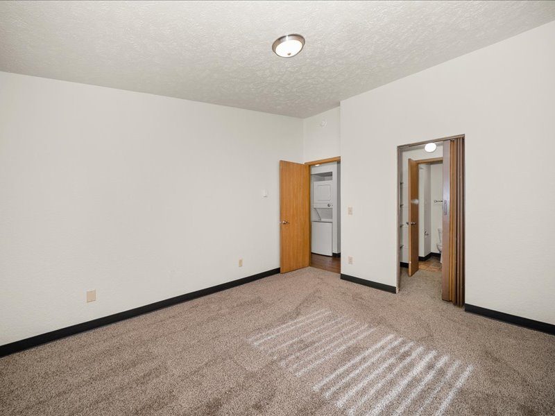 Primary Bedroom looking into hall and closet, unit style 2B